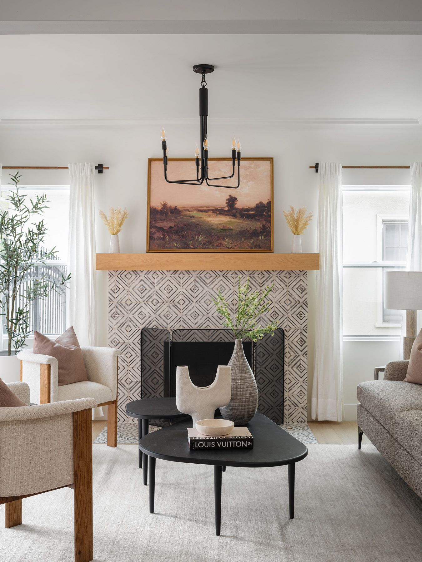 Tall windows and white drapery flank a tiled fireplace, illustrating window treatments in a daylight assessment.